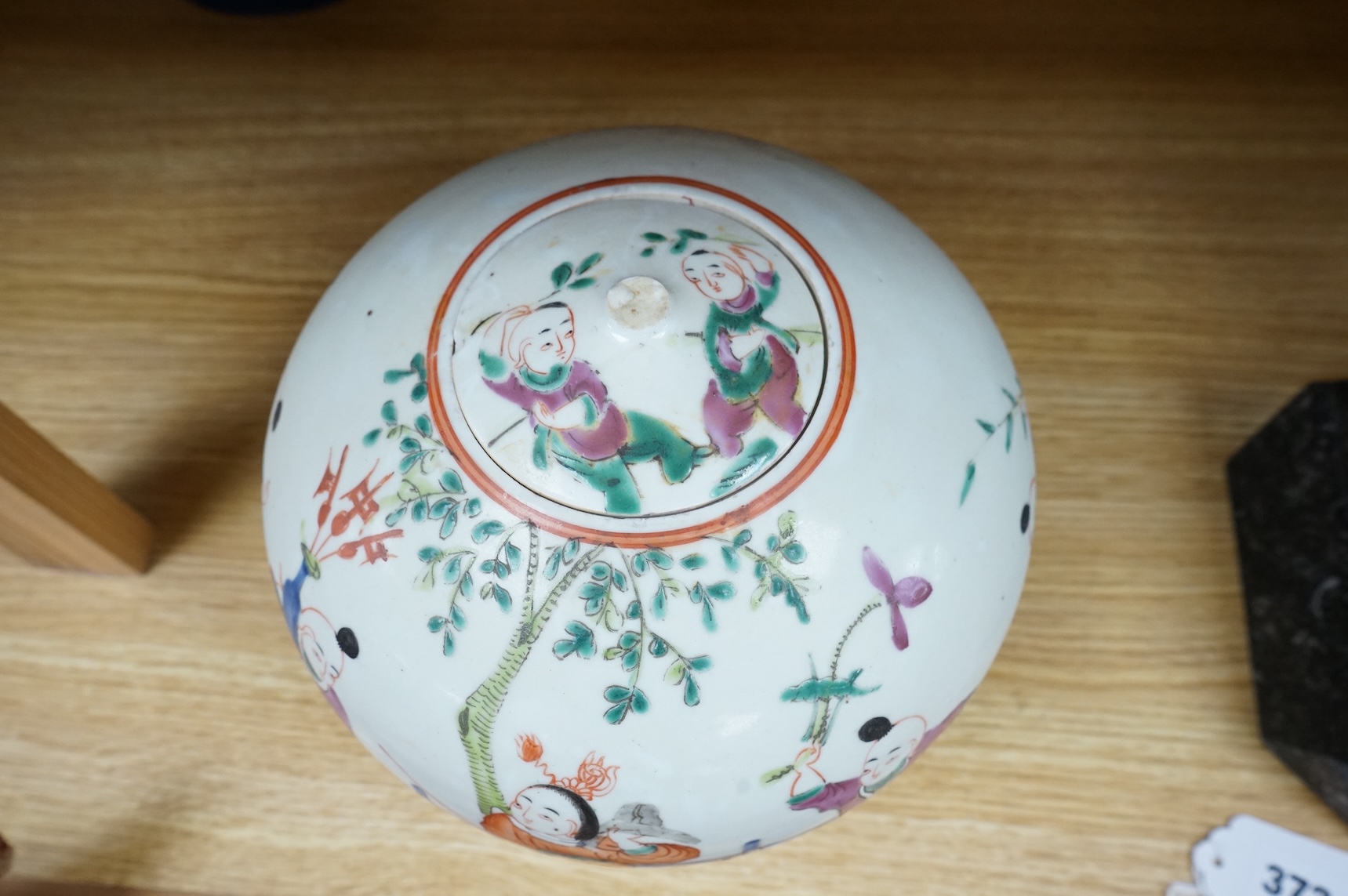A 19th century Chinese famille rose 'Boys' jar and cover, 19cm